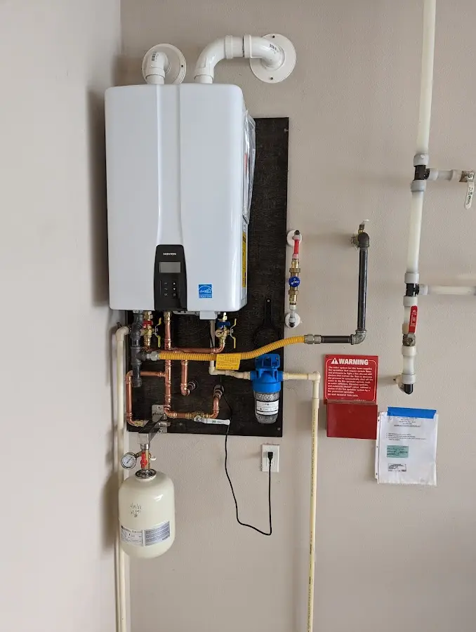 Professional plumber installing copper piping in a Taylor Lake Village home